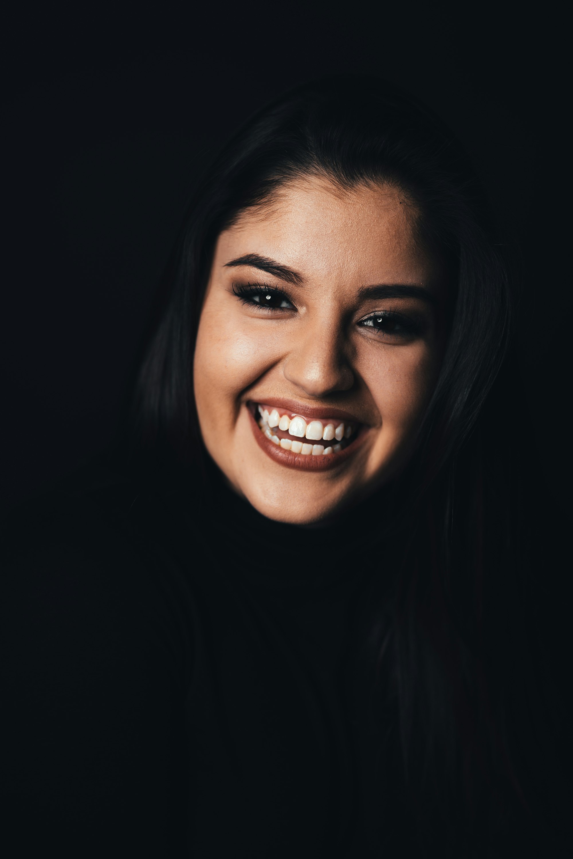 Radiant, confident patient smiling with healthy white teeth