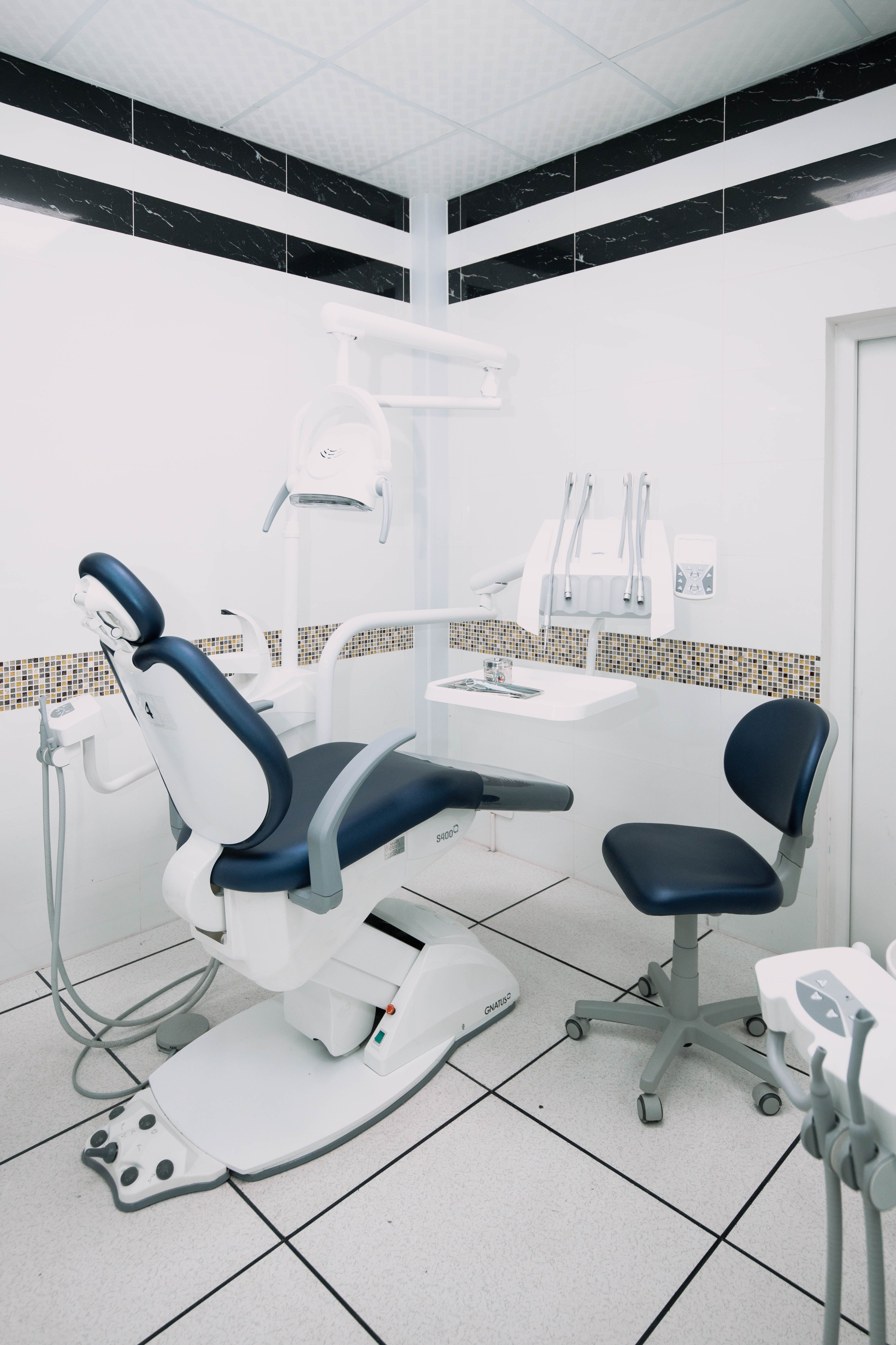 A comfortable, modern dental treatment room under soft overhead light