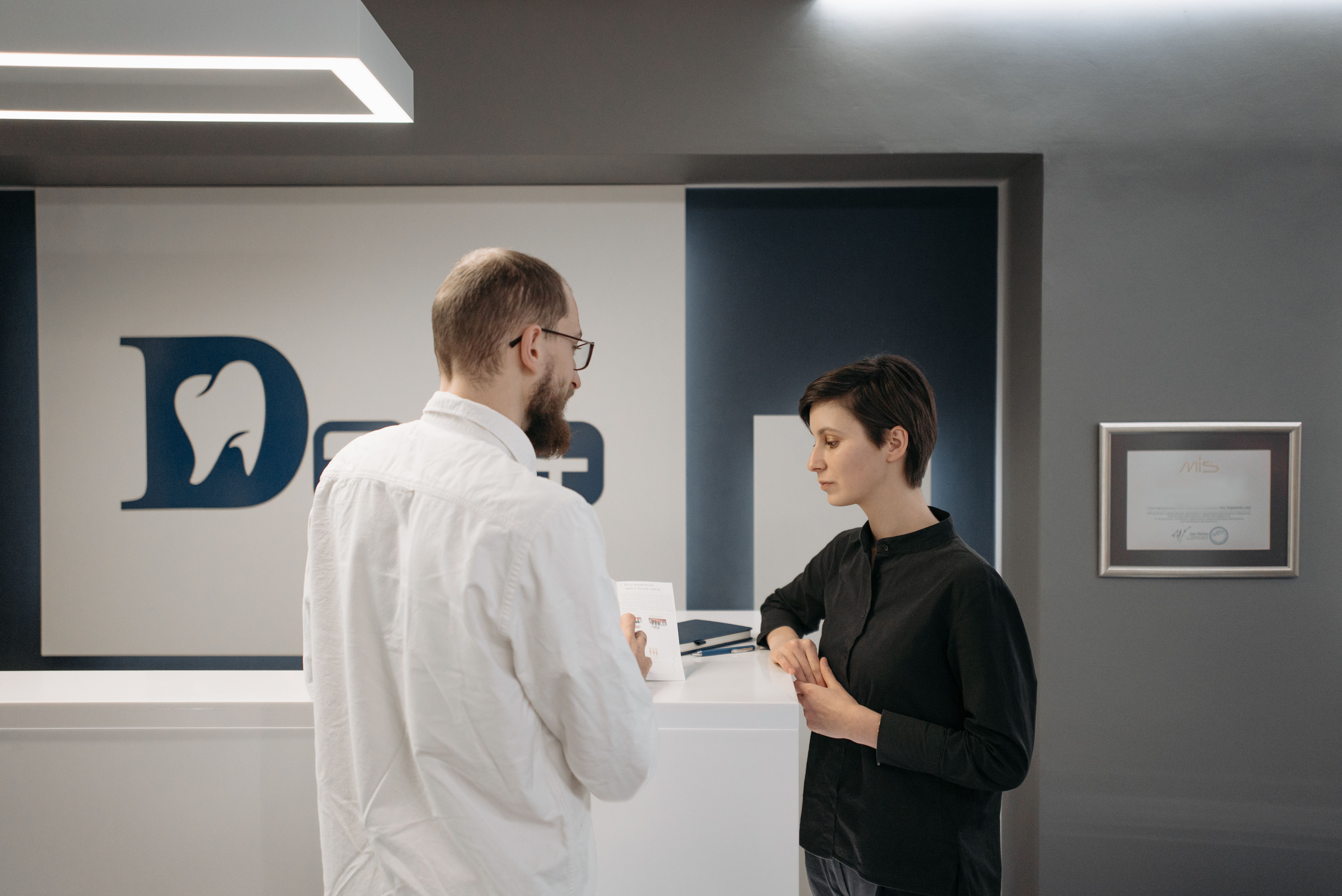 Dentist discussing a personalized treatment plan with a patient
